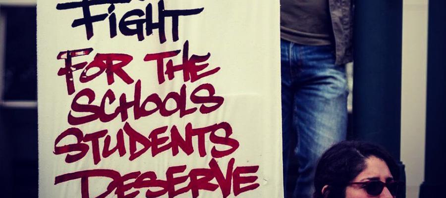 Sign saying fight for the schools students deserve! Schools and Communities First Petittion, Gavin Newsom, reform Prop 13, California, 2020 Election