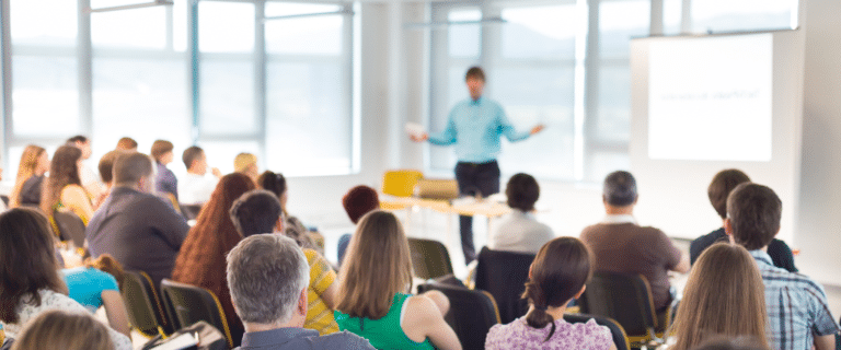 people sitting listening to a lecture