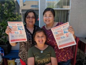 Family holding Easy Voter Guides (Easy Voter Guide, cavotes, voter guide, elections, California)
