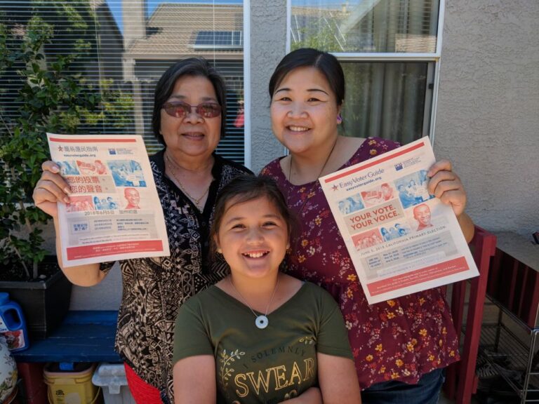 Family holding Easy Voter Guides (Easy Voter Guide, cavotes, voter guide, elections, California)